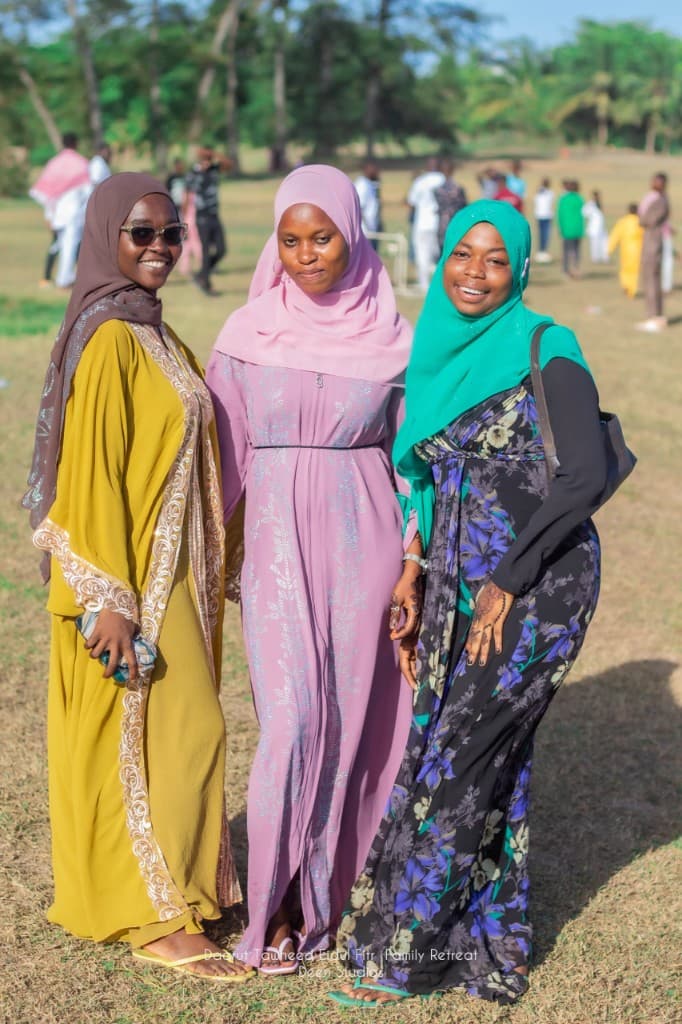 Three friends posing at the Daarut Tawheed Eidul Fitr Family Retreat