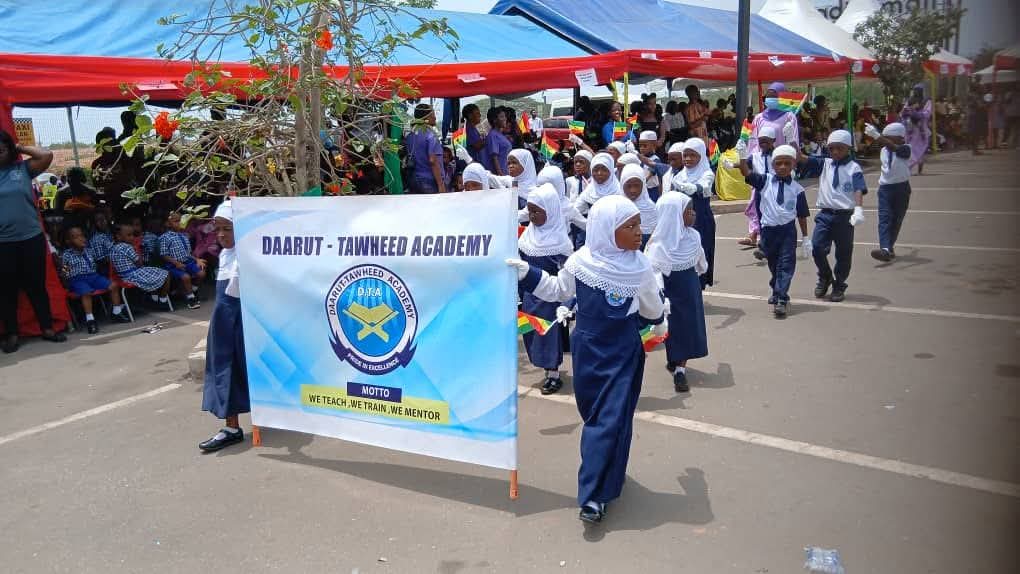 Daarut-Tawheed Academy students on parade with the academy banner